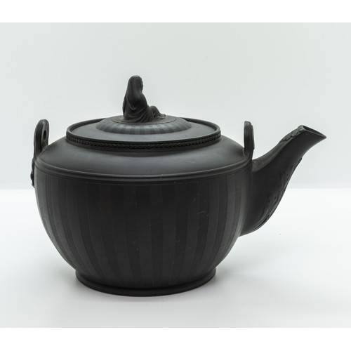 878 - A BLACK BASALT TEA KETTLECIRCA 1800Of neoclassical form and with engine turned decoration, 22cms wid... 