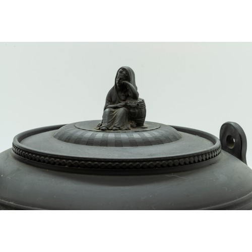 878 - A BLACK BASALT TEA KETTLECIRCA 1800Of neoclassical form and with engine turned decoration, 22cms wid... 