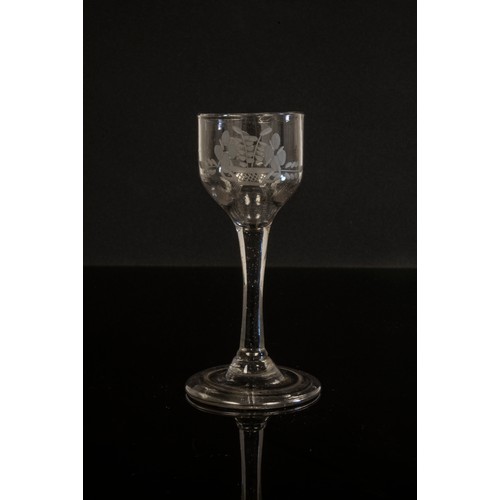 1222 - THREE GLASSESMID 18TH CENTURY Comprising two wine glasses with folded feet and a beer glass with hop... 