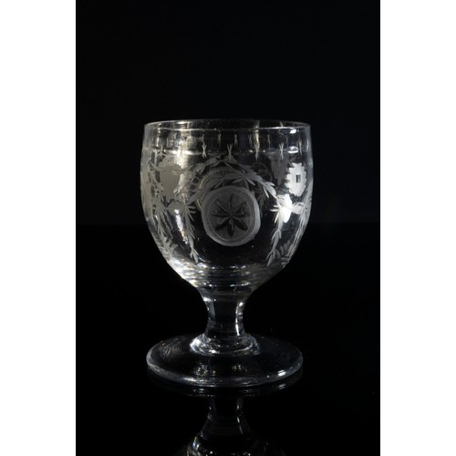 1224 - A NEOCLASSICAL WINE GLASSCIRCA 1780Engraved a continuous band of bulls head and urn motifs, 11cms hi... 