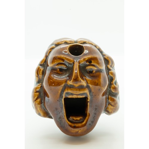 882 - A JOSEPH THOMPSON TREACLE GLAZED INK WELLEARLY 19TH CENTURYThe comical face with open mouth and wig,... 