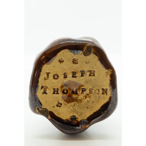 882 - A JOSEPH THOMPSON TREACLE GLAZED INK WELLEARLY 19TH CENTURYThe comical face with open mouth and wig,... 