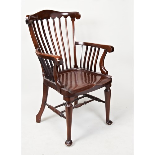 1543 - A MAHOGANY OPEN ARMCHAIR CIRCA 1900 with a shaped solid seat raised on turned legs ending in pad fee... 