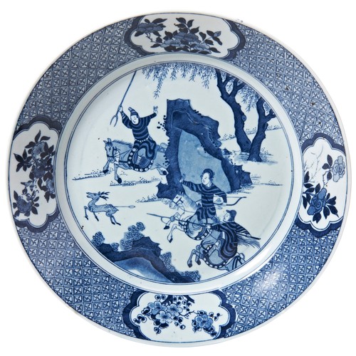 1997 - A CHINESE BLUE AND WHITE DISHKANGXI PERIOD (1662-1722)painted in tones of underglaze blue with a dee... 