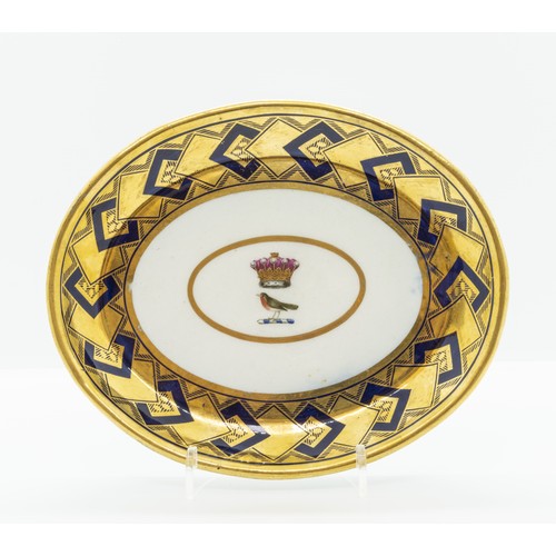 949 - AN ARMORIAL TEAPOT STANDcirca 1800, a robin beneath a coronet, within a blue and gold border