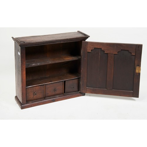 1585 - A GEORGE III OAK SPICE CUPBOARD18TH CENTURYwith a fitted interior 69cm wide, 61cm high, 23cm deep... 