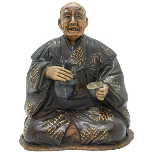 2181 - A JAPANESE POTTERY NODDING-HEAD FIGURELATE EDO / EARLY MEIJI PERIOD modelled as an elderly man drink... 