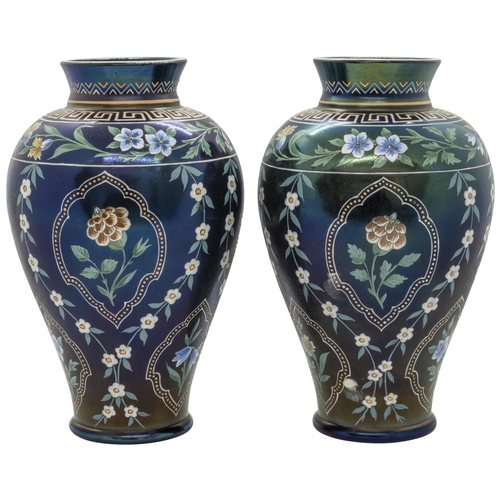 1229 - A PAIR OF IRIDESCENT GLASS AND ENAMELLED VASES19th century, 21cms high