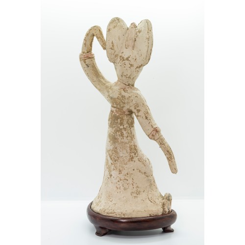 2029 - A CHINESE POTTERY FIGURE OF A SLEEVE DANCERPROBABLY TANG DYNASTY with a fitted hardwood stand29cm hi... 