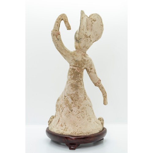 2029 - A CHINESE POTTERY FIGURE OF A SLEEVE DANCERPROBABLY TANG DYNASTY with a fitted hardwood stand29cm hi... 