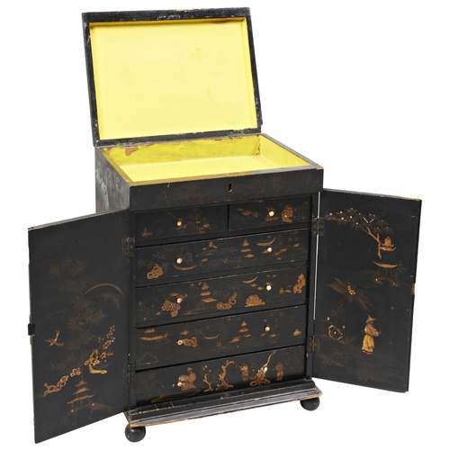 1673 - A BLACK JAPANNED COLLECTORS CABINETMID 19TH CENTURY with chinoiserie decoration throughout, the two ... 