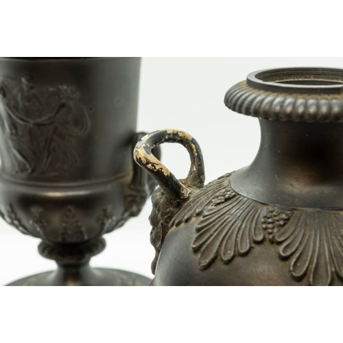 965 - A WEDGWOOD BLACK BASALT CAMPAGNA URN18TH CENTURYTogether with a pair of urns, 17cms high