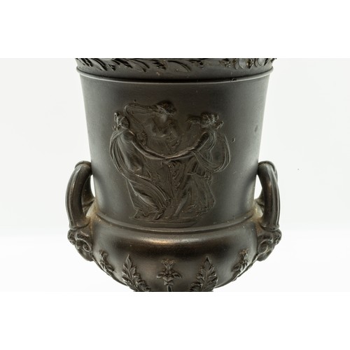 965 - A WEDGWOOD BLACK BASALT CAMPAGNA URN18TH CENTURYTogether with a pair of urns, 17cms high