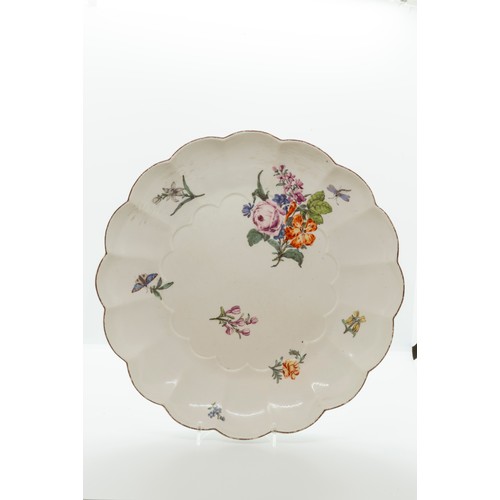 966 - A CHELSEA LOBBED DISHCIRCA 1750sPainted with scattered flowers, 27cms wide