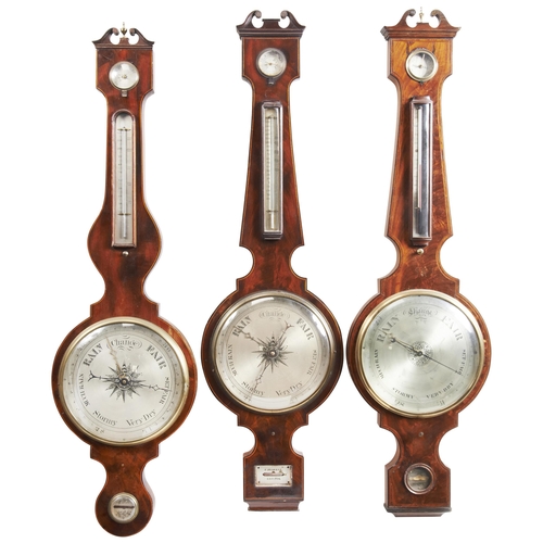 1445 - A GROUP OF THREE LARGE VICTORIAN MAHOGANY WHEEL BAROMETERS19TH CENTURYtwo with signed dials, W. Hans... 