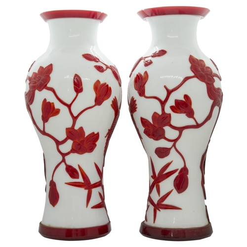 2151 - A PAIR OF CHINESE RED-OVERLAY ON WHITE GLASS VASESLATE QING / REPUBLIC PERIOD of baluster form35cm h... 