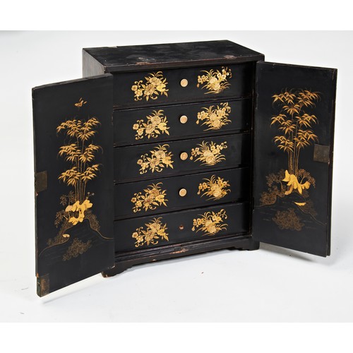 2176 - A CHINESE LACQUER AND GILT-DECORATED TABLE CABINETQING DYNASTY, 19TH CENTURYthe two doors enclosing ... 