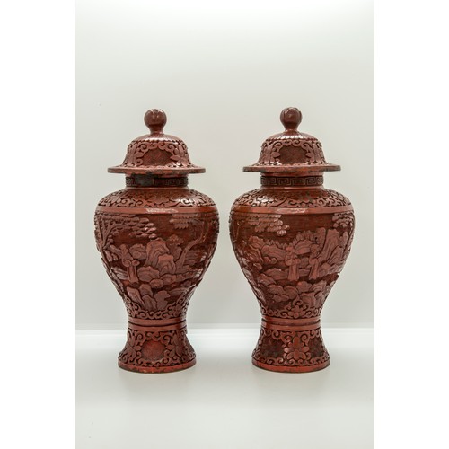 2160 - A PAIR OF CHINESE CINNABAR LACQUER BALUSTER VASES AND COVERSLATE QING DYNASTY25cm high