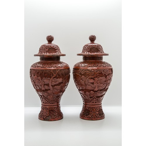 2160 - A PAIR OF CHINESE CINNABAR LACQUER BALUSTER VASES AND COVERSLATE QING DYNASTY25cm high