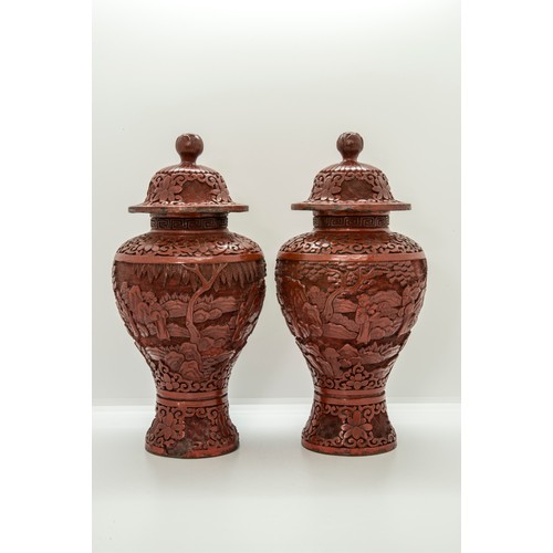 2160 - A PAIR OF CHINESE CINNABAR LACQUER BALUSTER VASES AND COVERSLATE QING DYNASTY25cm high