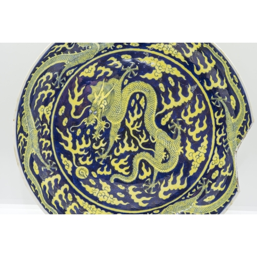 2062 - A CHINESE YELLOW-ENEAMEL BLUE GROUND 'DRAGON' DISHGUANGXU SIX CHARACTER MARK AND OF THE PERIOD25cm d... 