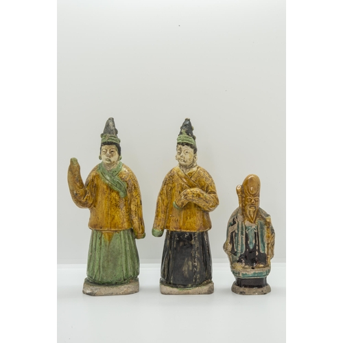 2064 - A PAIR OF SANCAI GLAZED POTTERY FIGURESMING DYNASTY20cm high; together with A CHINESE GLAZED POTTERY... 