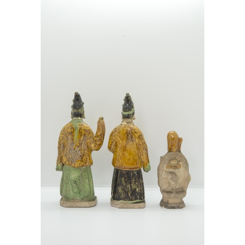 2064 - A PAIR OF SANCAI GLAZED POTTERY FIGURESMING DYNASTY20cm high; together with A CHINESE GLAZED POTTERY... 