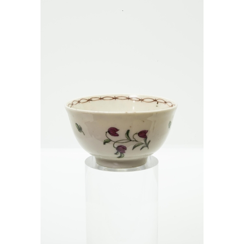 980 - A BRISTOL PORCELAIN TEA BOWL AND SAUCERwith blue 'X' mark and painters marks to bases, 12cm