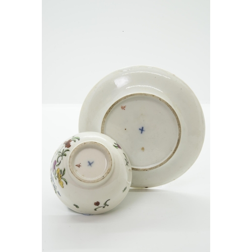 980 - A BRISTOL PORCELAIN TEA BOWL AND SAUCERwith blue 'X' mark and painters marks to bases, 12cm