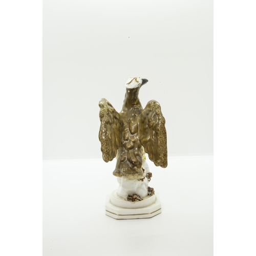 990 - AN ENGLISH PORCELAIN MODEL OF AN EAGLECirca 1830, 19cms high