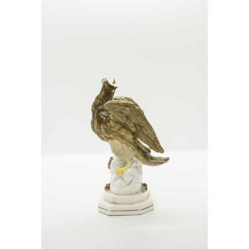 990 - AN ENGLISH PORCELAIN MODEL OF AN EAGLECirca 1830, 19cms high