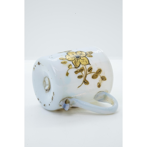 1006 - A MILK GLASS TEA BOWL18th Century, with enameled decoration together with a coffee can with cold pai... 