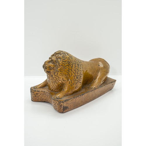 1013 - A NAIVE STONEWARE LION19th Century, 20cms