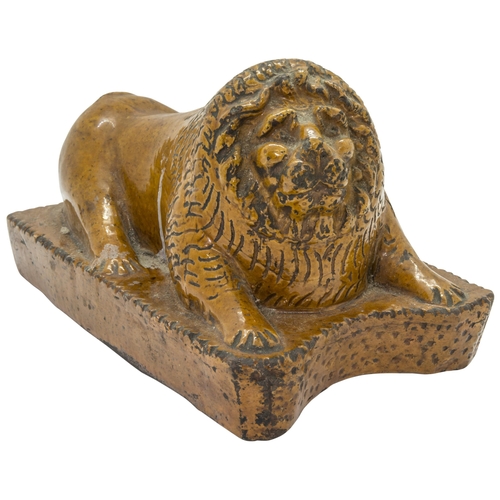 1013 - A NAIVE STONEWARE LION19th Century, 20cms