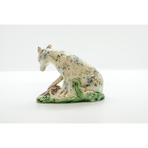 1014 - A WHEILDON TYPE STAFFORDSHIRE FIGURE OF A WOLF18th Century, 11cms