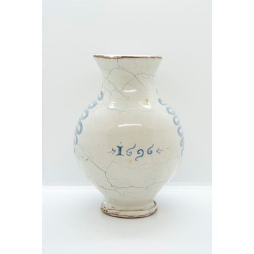 1017 - A LATE 17TH CENTURY ITALIAN DRUG JARDated 1696 and 'OLio D CAMOMILa' 20cms high