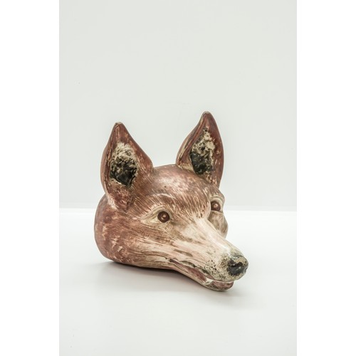 1041 - A PEARLWARE STIRUP CUPCirca 1800 of fox head form, 15cms