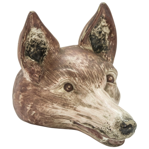 1041 - A PEARLWARE STIRUP CUPCirca 1800 of fox head form, 15cms