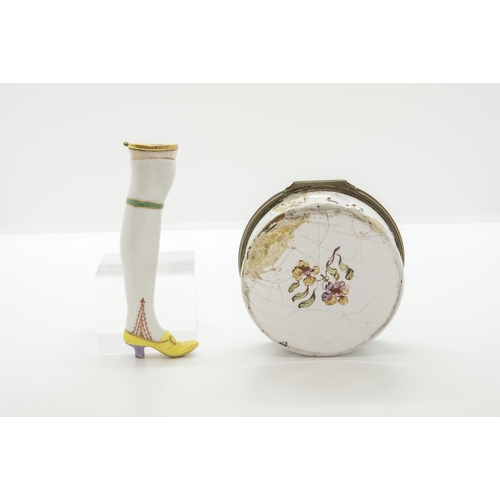 1061 - AN ENAMEL SNUFF BOX18th century, together with a bodkin case of leg form, box is 8cms