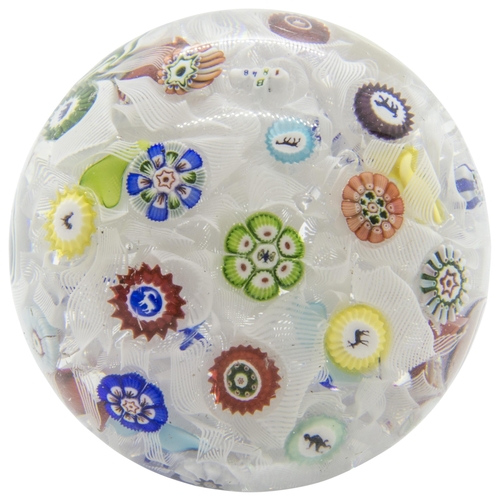 1240 - A BACCARAT PAPERWEIGHT, DATED 1848With tumbled muslin ground and various animal canes, 7.5cms