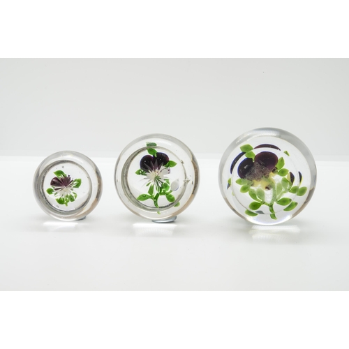 1244 - THREE BACCARAT PANSY PAPERWEIGHTS19th Century, largest is 7.5cms wide