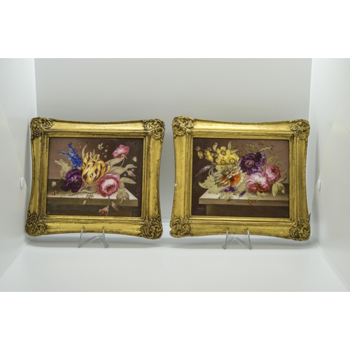 1063 - A PAIR OF PORCELAIN FLORAL PLAQUES AND A FURTHER PLAQUE19th century, the pair in gilt frames, larges... 