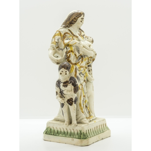 1073 - A STAFFORDSHIRE FIGURE OF CHARITY IN PRATT COLOURSCirca 1800, 24cms high