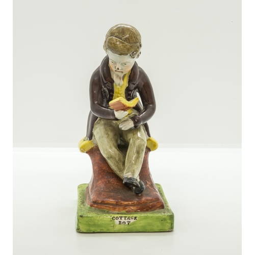 1077 - A PEARLWARE FIGURE OF SEATED BOY READINGCirca 1820, the base entitled 'COTTAGE BOY', 14.5cms high... 