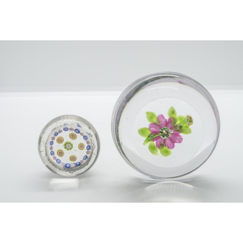 1254 - A FLOWER PAPERWEIGHT AND A SMALL MILLEFIORE WEIGHTLate 19th century, largest is 8cms