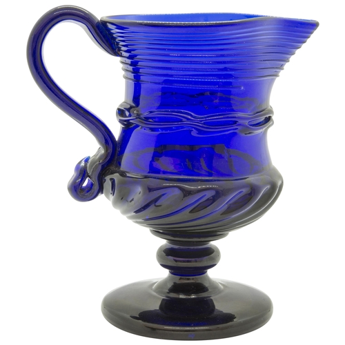 1255 - A 'BRISTOL' BLUE JUG18th century, raised on a foot, 12cms high