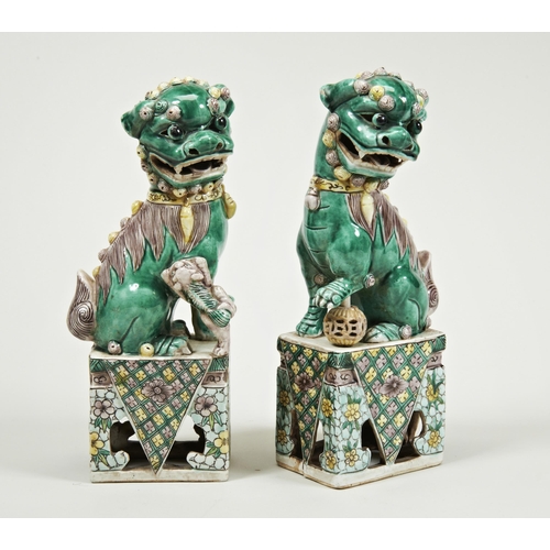 2114 - A PAIR OF CHINESE FAMILLE VERTE BUDDHIST LIONSLATE QING DYNASTY26cm high