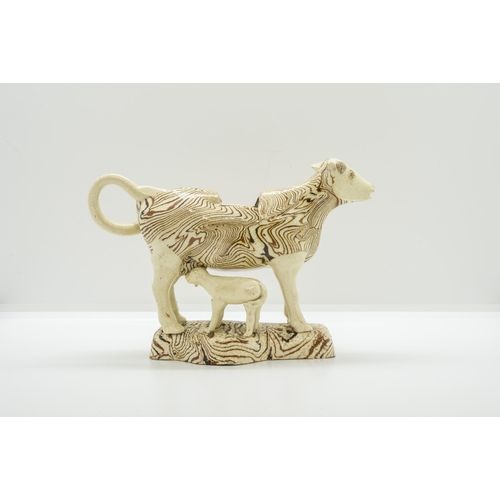 1089 - A PINK LUSTRE COW CREAMER AND MARBLED COW CREAMERCirca 1840, the marbled example with calf, 19cms... 