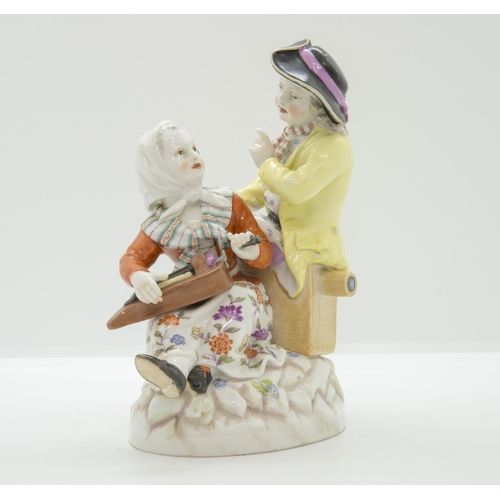 1095 - A BERLIN FIGURE GROUP19th Century, a woman with a hurdy-gurdy and a man with a  magic lantern, 16cms... 