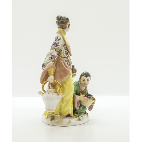 1096 - A MEISSEN FIGURAL GROUP OF JAPANESE WOMAN WITH A TEA KETTLE AND TWO CHILDREN20th century, with blue ... 